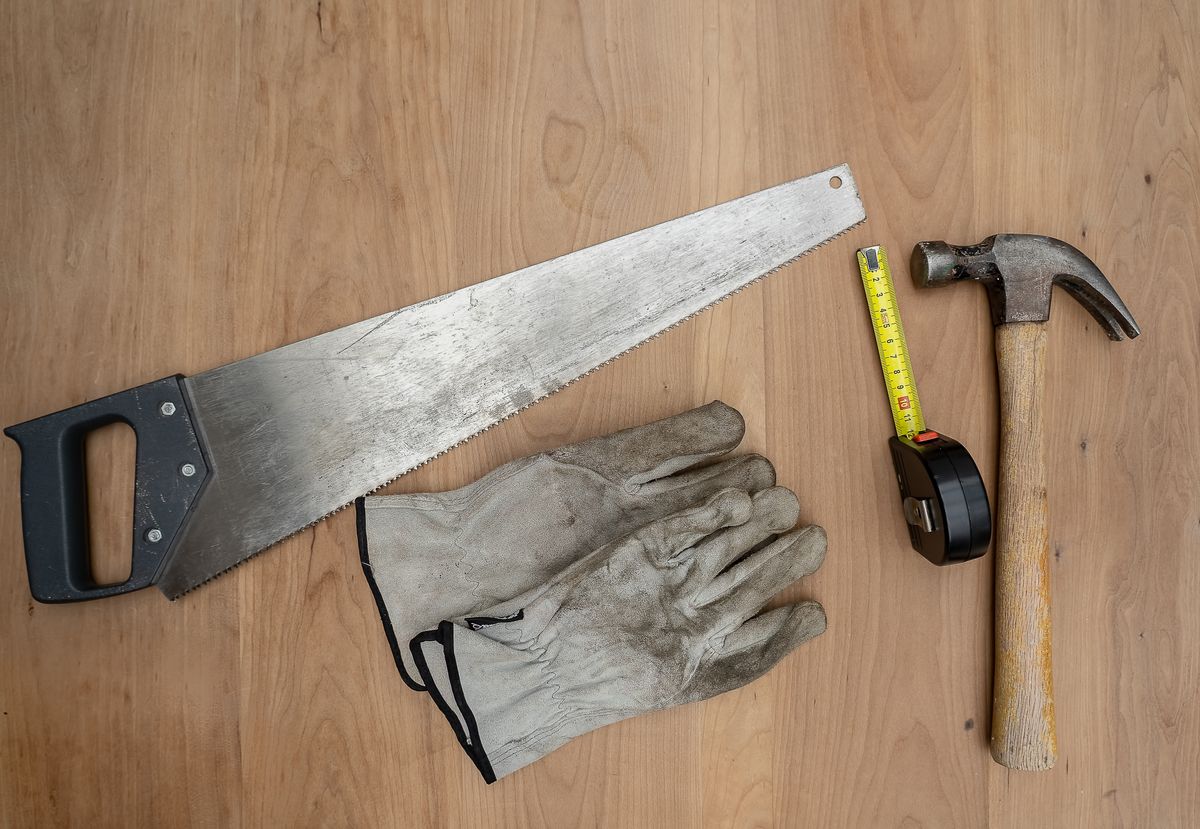 Carpentry tools laid out on a wooden surface